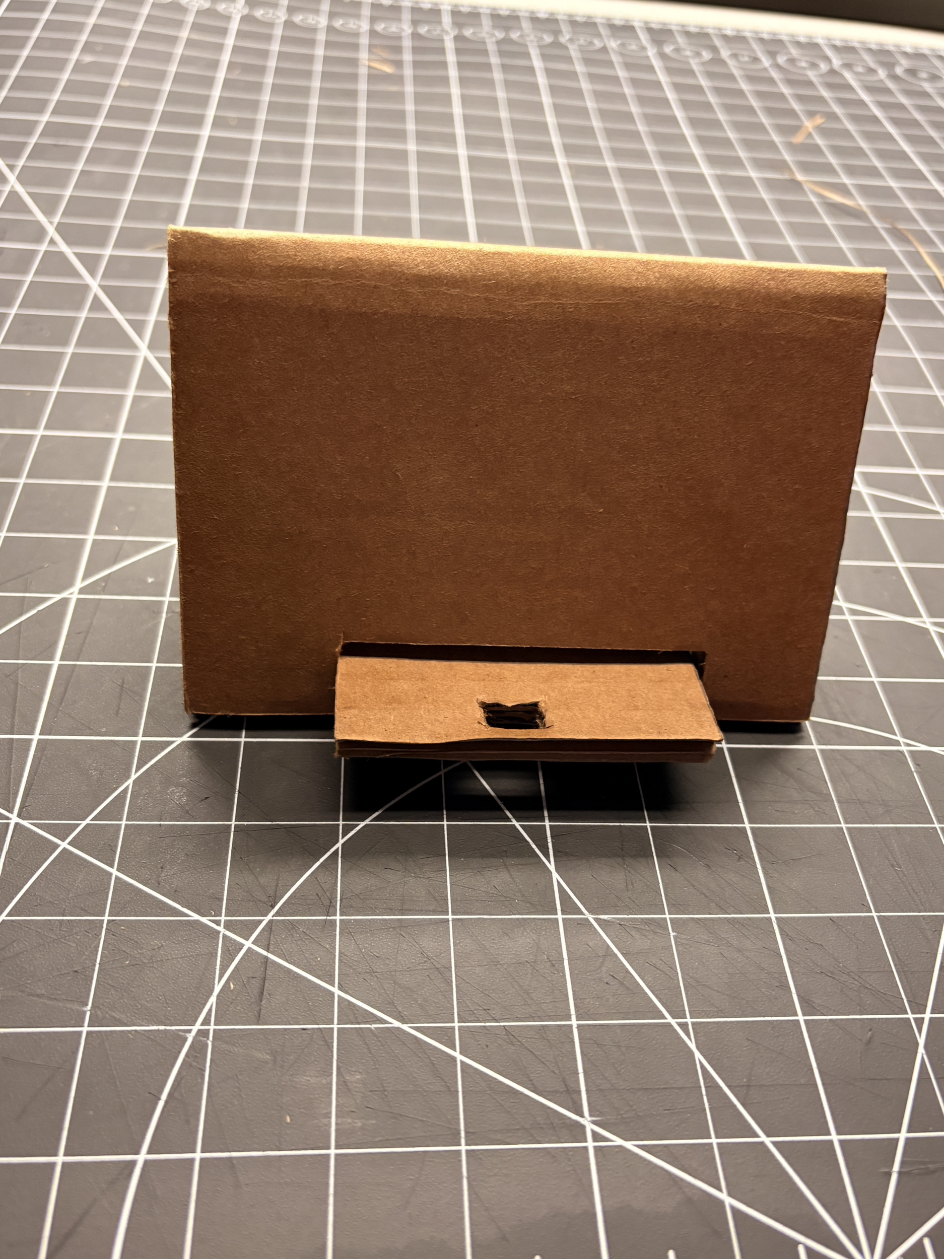 For our newest adaption, we added a space where you can put a charger through to charge your phone. That way it can be a stand for your phone but also be charging. All at once.