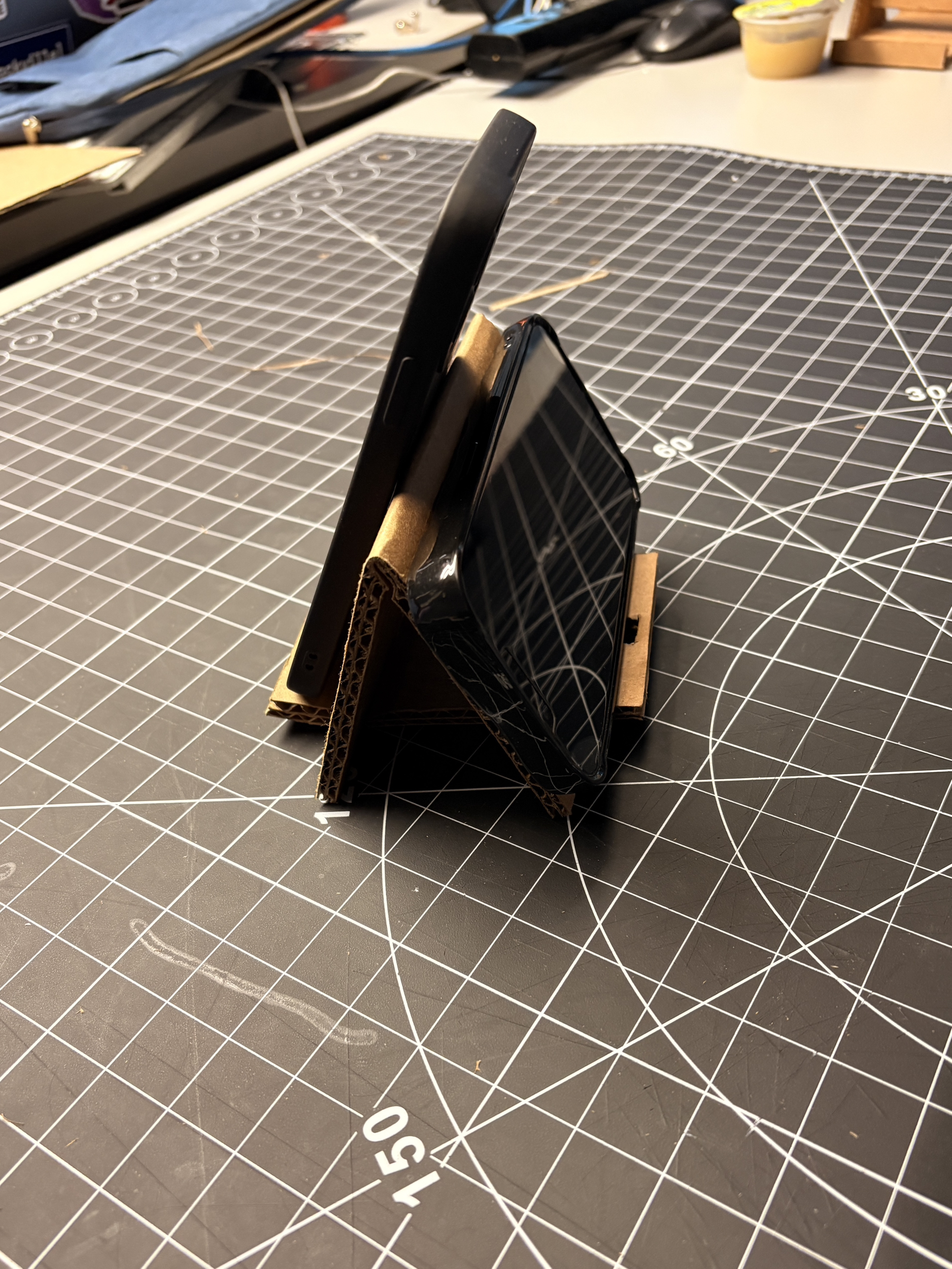 Our phone stand is not just for one phone, but for two. And both sides have a space where you can charge it, and it doesn't get in your way. So it's perfect for when multiple people need to use it.